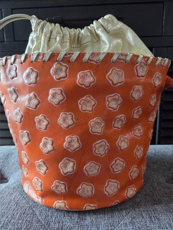 Pulicati Handbags - PULICATI Orange Floral Embossed Leather Bucket Bag with Gold Drawstring